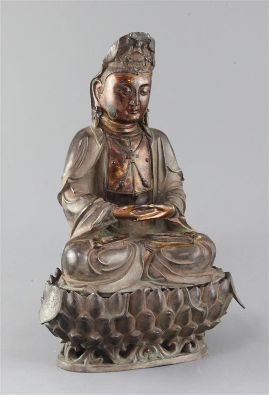 A large Chinese lacquered bronze seated figure of Guanyin, H. 35cm